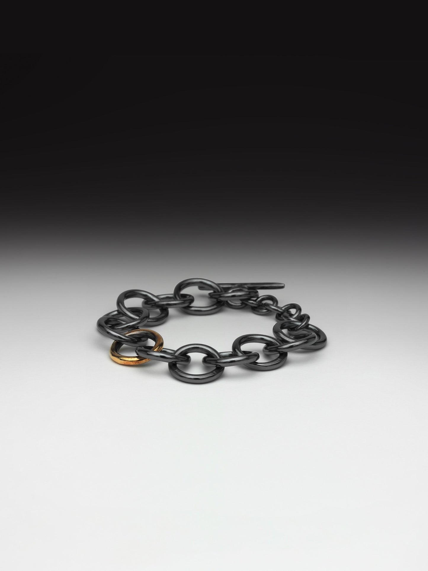 Oxidized Chunky Silver Bracelet with Gold Link